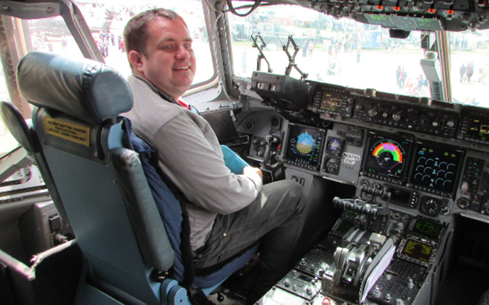our tenant David smiling from the cockpit of a helicopter 
