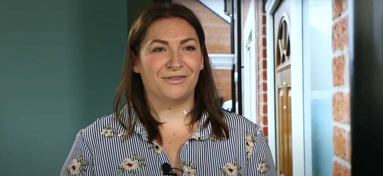 Tenant Cat, smiling while talking in interview 
